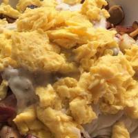 Country Skillet · Eggs, potatoes, bacon, sausage, ham, cheddar cheese & sausage gravy.