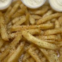 Truffle Parmesan Fries · Extra Crispy Battered Fries, Tossed in Truffle Oil, Parmesan and Sprinkle of parsley. Side O...