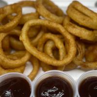 Onion Rings · Beer Battered Onion Rings, Comes with your choice of Ranch or BBQ Sauce for dipping.