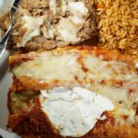 Enchiladas Suizas (3) · Choice of chicken or beef, served with rice and beans.