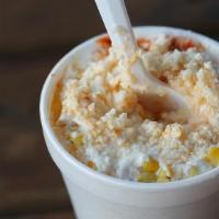 Elote (Large) · Corn in a cup topped with mayonnaise, cheese, butter and chile powder.