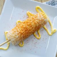 Elote (Small) · Corn in a cup topped with mayonnaise, cheese, butter and chile powder.