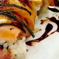 Witchy Woman · Inside: Hamachi, spicy tuna, avocado, pickled daikon. Outside: salmon, fresh orange, ponzu &...