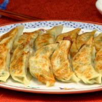 Gyoza · Five Pieces. Pork and vegetable filled dumplings, pan-fried and steamed to finish. Served wi...