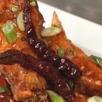 Asian Chicken Wings · Six Pieces. Crispy fried. Tossed in spicy Asian rub or basil.