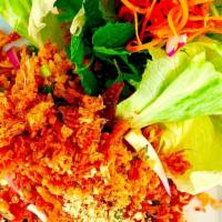 Lettuce Wraps · Crispy curried rice mixed with Asian-seasoned pork sausage and scallions. Roll your own wraps!