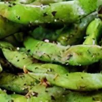 Adulterated Edamame · You will never eat edamame “naked” again! Edamame tossed in a rich dark, garlic chili glaze ...