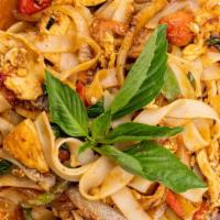 Drunken Noodles · Spicy and delicious! Wide rice noodles made richer with egg. Onion, scallions, tomatoes and ...