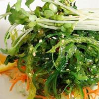 Seaweed Salad · The traditional japanese favorite. marinated seaweed & cucumbers beautifully garnished with ...