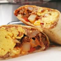 Burrito Mañanero · Breakfast burrito. Refried pinto beans, sauté onions and peppers, potatoes, scrambled eggs, ...