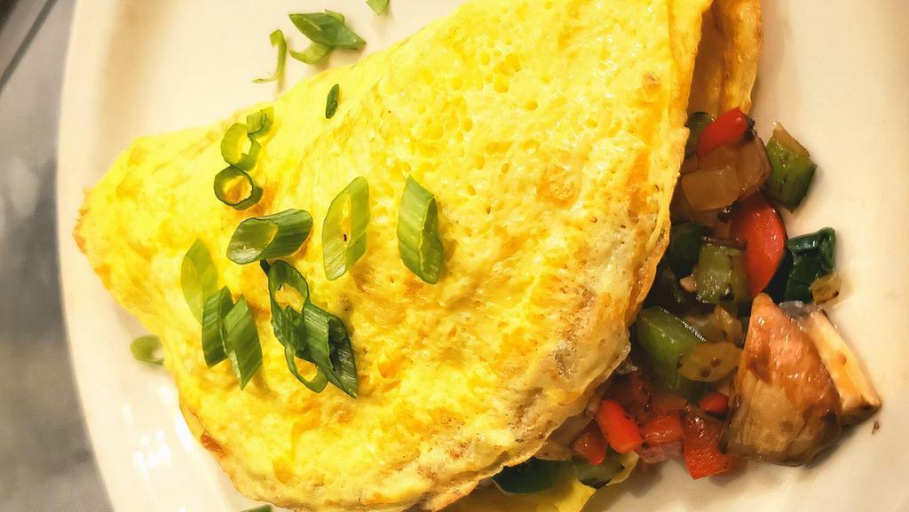 Omelette · Eggs, bell pepper, onions, mushrooms, spinach and melted cheese with a side of salsa.