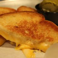 Grilled Cheese On Texas Toast · Two pieces of swiss, two pieces of American cheese on grilled Texas toast.
