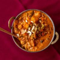 Nav Ratan Korma · Cauliflower, potato, green beans, garbanzo beans, lima beans, green peas and carrots sautéed...