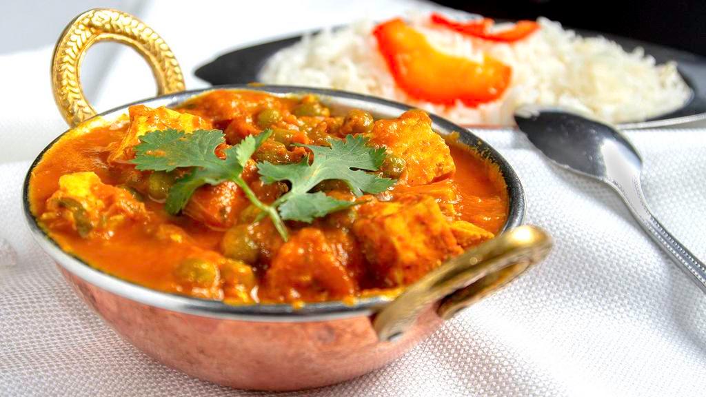 Mattar Paneer · Fresh homemade cottage cheese (paneer) cooked gently with tender green peas and fresh spices.