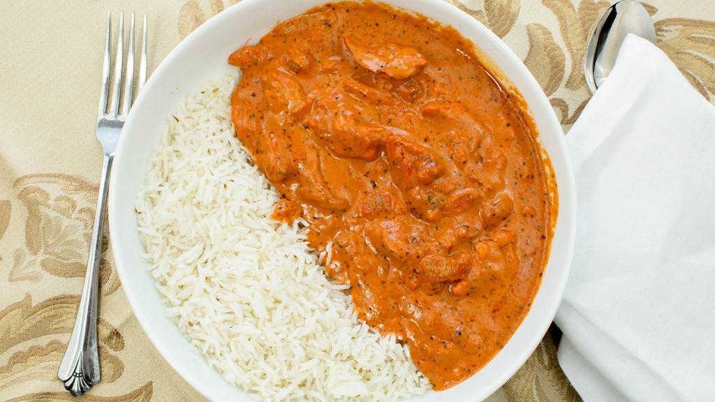 Chicken Makhani · Boneless dark (leg and thigh) tandoori chicken cooked in tomato and butter sauce with crushed cashews.
