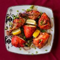 Tandoori Chicken (6 Pieces) · Chicken marinated in yogurt with spices and grilled in tandoor oven.