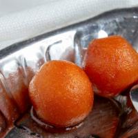 Gulab Jamun (2) · A North Indian sweet made mixture of flour and milk, fried in soybean oil, soaked in honey s...