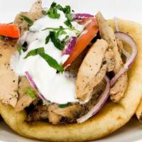 Chicken Gyros Pita · Hand carved chicken on a pita. Served with tzatziki, tomatoes and onions.