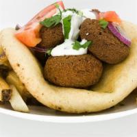 Falafel Pita · Fried vegetarian patty with chickpeas, herbs and spices on a pita.  Served with tzatziki, to...