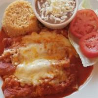 Enchiladas Rojas · Three corn tortillas filled with cheese, onions and topped with melted cheese, covered with ...