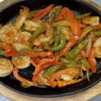 Fajitas Shrimp & Steak Combination · Steak and Shrimp, roasted onions, tomatoes, bell peppers. Served with Spanish rice, pinto be...