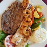 Tres Amigos · Charbroiled rib-eye steak, grilled chicken breast, and grilled shrimp, served with white ric...
