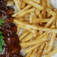 Pork Bbq Ribs · Pork ribs in our house bbq sauce. Served with home made coleslaw, house french fries sprinkl...