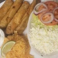Chicken Flautas · Three crispy rolled tacos filled with shredded chicken, shredded cabbage, cured onions and c...