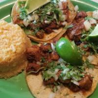 Al Pastor Tacos · Three shepherd style tacos - central mexico most iconic taco. Guajillo, Pineapple marinated ...