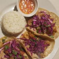 Shrimp Tacos · Tree spicy shrimp tacos, red cabbage, onions, tomatoes, cilantro. And white rice.
