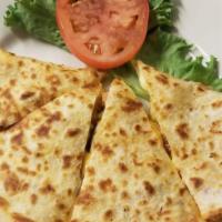 Quesadilla Grande · Crispy flour tortilla filled with your choice of meat, melted cheddar, monterrey jack and mu...