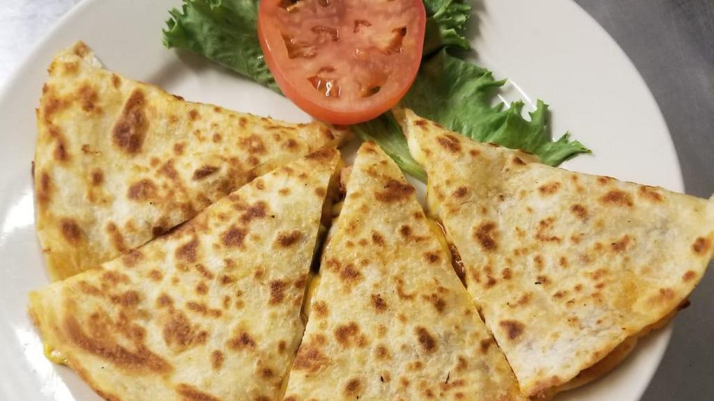 Kid'S Quesadilla · Flour tortilla with melted cheese, served with sour cream and Mexican rice.