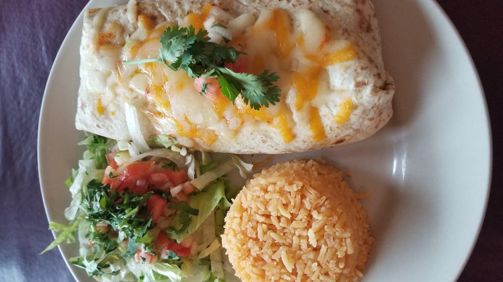 Burrito Grande · Flour tortilla filled with black bean cream, cheese and choice of ground beef, chicken, steak or pork. Served with lettuce, pico de gallo and Spanish rice. Burrito Macho topped with melted cheese and red sauce.