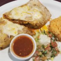 Breakfast Burrito Grande · Flour tortilla filled with scrambled eggs, chorizo, cheese, smashed potatoes, roasted onions...