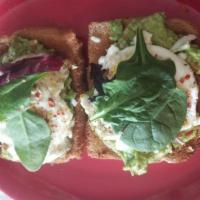 California Avocado Toast · Wheat toast and mashed avocados, red pepper flakes, queso fresco, cilantro and a poached egg.