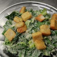 Caesar Salad · Romaine lettuce, croutons, and freshly grated parmesan cheese. Tossed with caesar dressing.