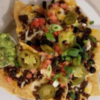 Nachos · Choice of ground beef, chicken or pork. Black beans, tomatoes, scallions, black olives and j...