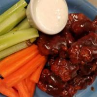 Boneless Chicken Wings (10 Pc) · Mild, hot, thai chili, honey BBQ or BBQ, served with celery and carrot sticks, ranch or bleu...