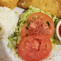 Kid'S Potato Tacos · Two crispy potato tacos served with shredded cabbage, tomatoes, queso fresco and Mexican rice.