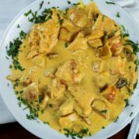 Chicken Curry · Sautéed chicken in curry sauce with potatoes, carrots, green peppers, onion, plums and raisi...
