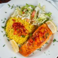 Salmon · Fresh filet of salmon is seasoned with spices and grilled to perfection. Served with grilled...