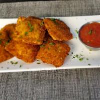 Fried Cheese Ravioli · Fried ravioli pasta filled with Ricotta cheese and served with our marinara sauce.