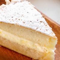 Italian Lemon Cream Cake · Layers of yellow cake filled with Italian lemon cream, finished with vanilla cake crumb on t...