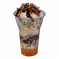 Made With Snickers® Layered Sundae · Three scoops of Made with SNICKERS® Ice Cream, crushed SNICKERS® pieces and caramel layers, ...