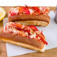 Lobster Roll · wildcaught lobster meat in a buttered & toasted bun w/ lemon butter, mayo, & seasoning.