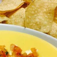 Cheese Dip · Nacho Cheese, Pico de Gallo, Jalapeño Peppers, and Tortilla Chips