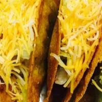 #11 - Fried Taco Combo · Three Fried Beef Tacos, Rice, Beans, Lettuce, and Shredded Cheese