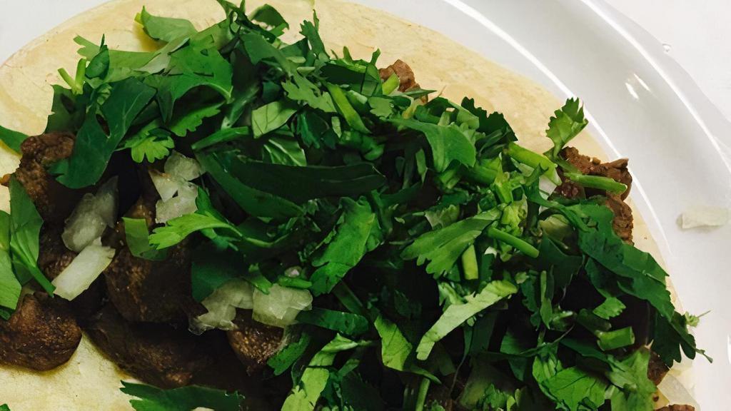 Street Taco · Corn Tortilla, Choice of Meat, Onions, and Cilantro