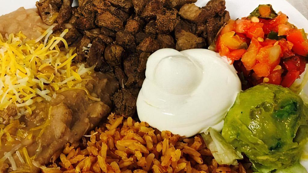 Asada Platter · Asada (Marinated Beef), Rice, Beans, Sliced Jalapeños, Guacamole, Sour Cream, Pico de Gallo, and warm Tortillas