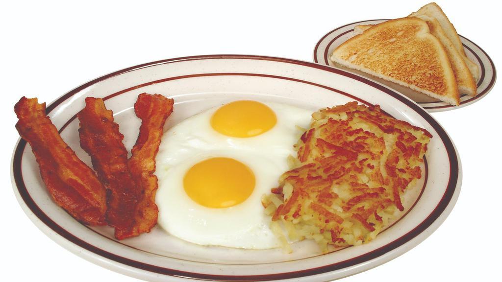 All-American Breakfast · Two eggs, golden hashbrowns and your choice of bacon, ham or sausage (patties or links).